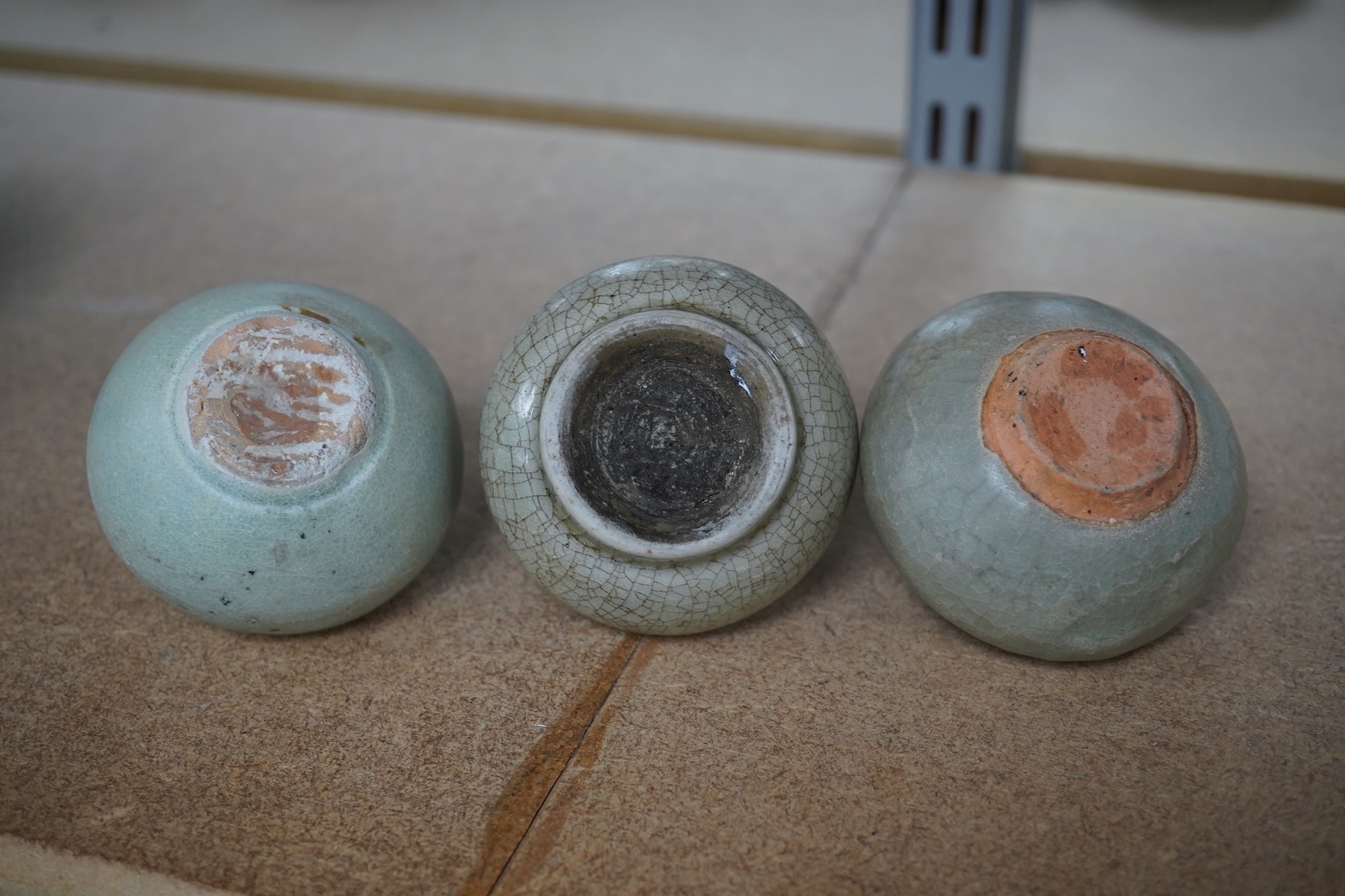 Two Chinese celadon jarlets, Yuan dynasty and a crackle glaze jarlet, tallest 6cm. Condition - good